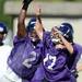 Pioneer players reach for the ball during a morning practice at Pioneer High School on Monday. Melanie Maxwell I AnnArbor.com